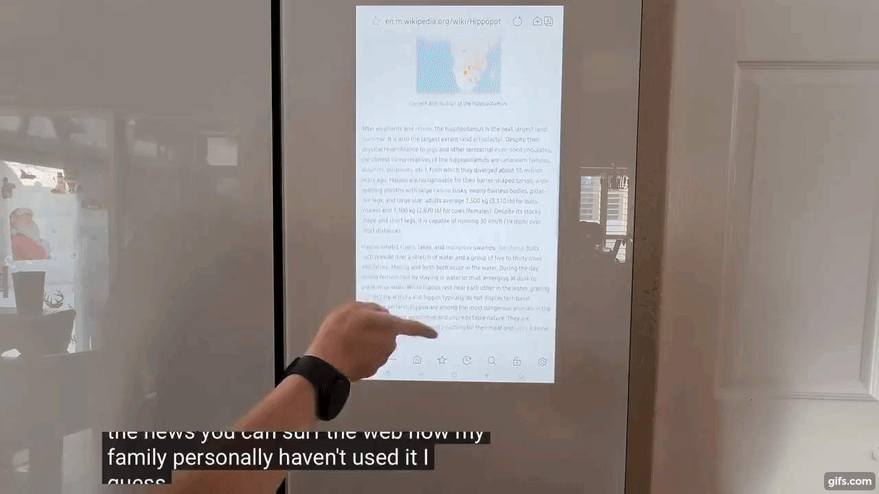 Gif of a person in front of a smart refrigerator.